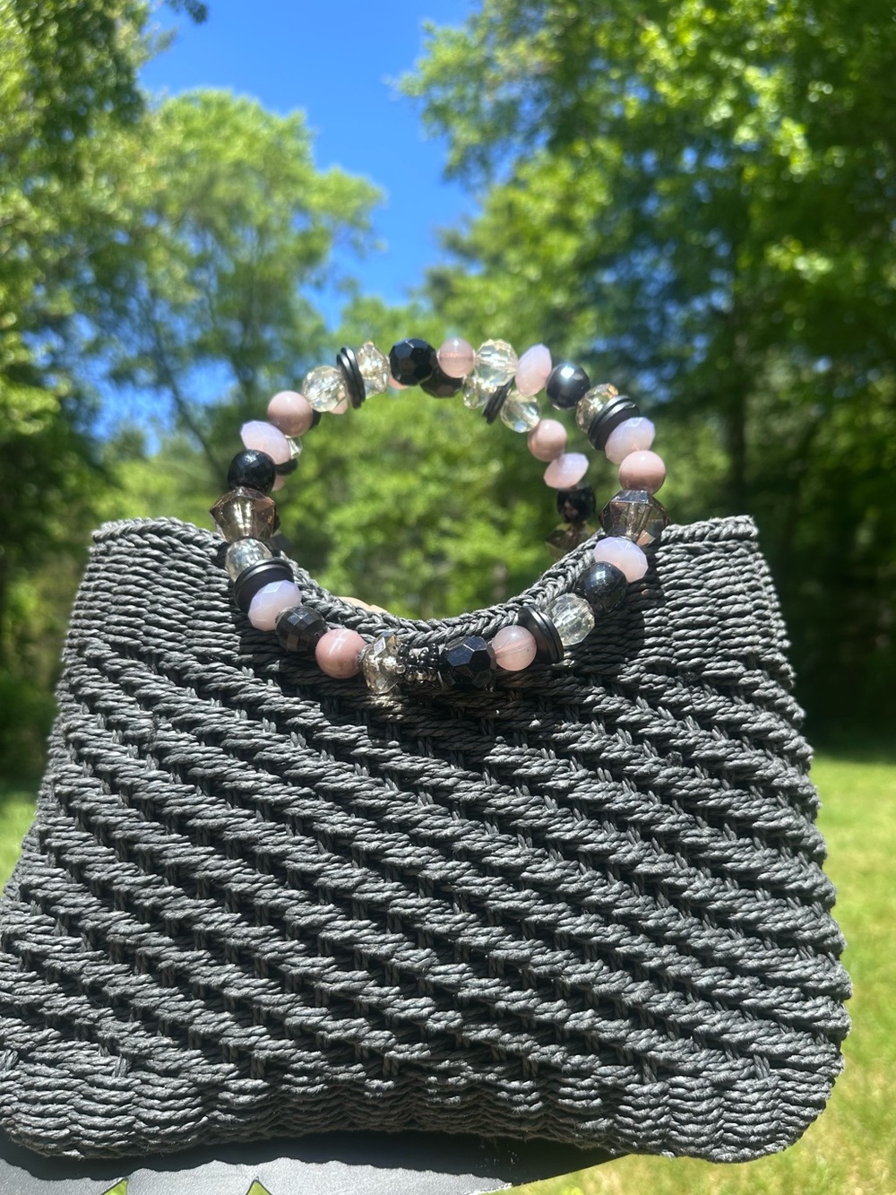 Many Moods of Poppie Jones Beaded Handle Black Woven Clutch Handbag